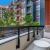 Patio with chair in the middle of the complex with view of pool